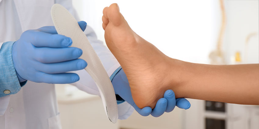 patient receiving custom orthotics in Irvine